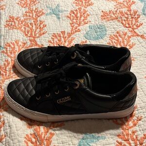 Guess sneakers. Looks like never worn, except for bottoms has a little use.